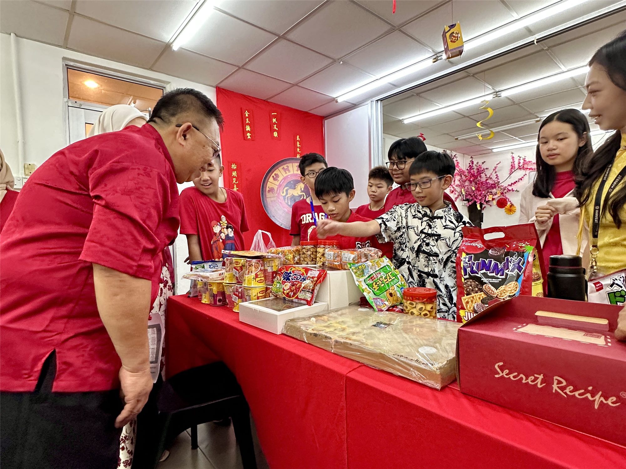 Year 7 Harvest Academy students explaining their food to guests at the Chinese New Year carnival