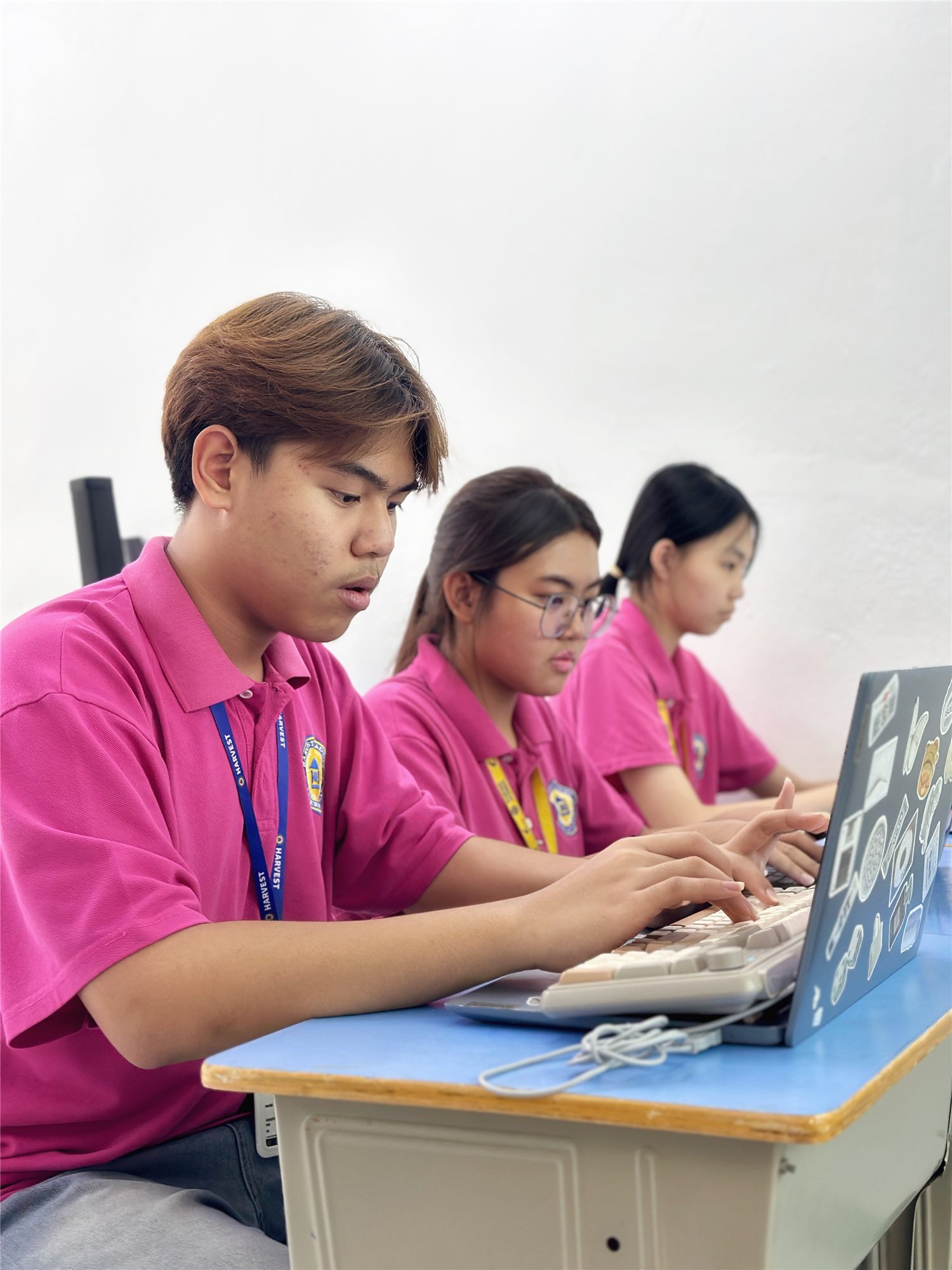 Harvest Academy students coding on laptops in an ICT lesson
