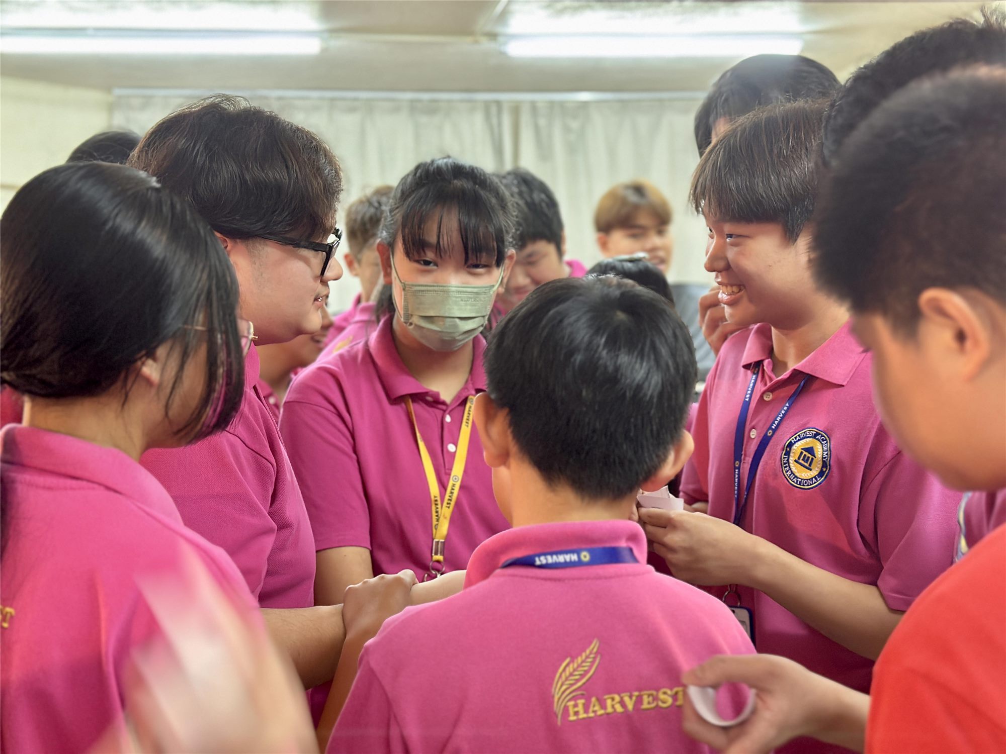 Harvest Academy students in a group discussion during a school assembly activity
