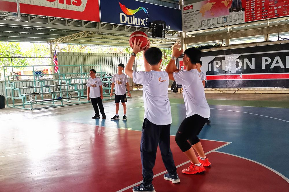 Harvest Academy students playing basketball